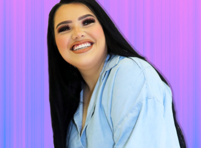 YouTube creator Karina Garcia wearing a jean jacket with a blue and pink background