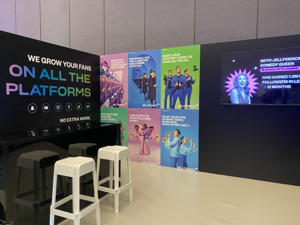 A view of the colorful Jellysmack branded booth on the Industry Track at VidCon 2022. 