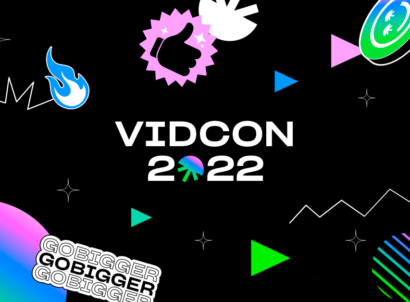 VidCon 2022 text on black background with rainbow gradient graphics.