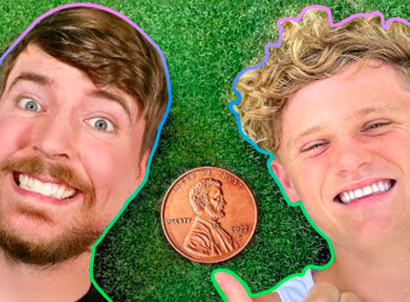 Close up of YouTube creators Ryan Trahan and MrBeast smiling while Trahan points to a penny