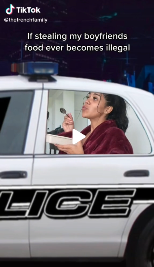 TikTok creator The Trench Family pretending to be in a police car with the text "If stealing my boyfriend's food ever becomes illegal"