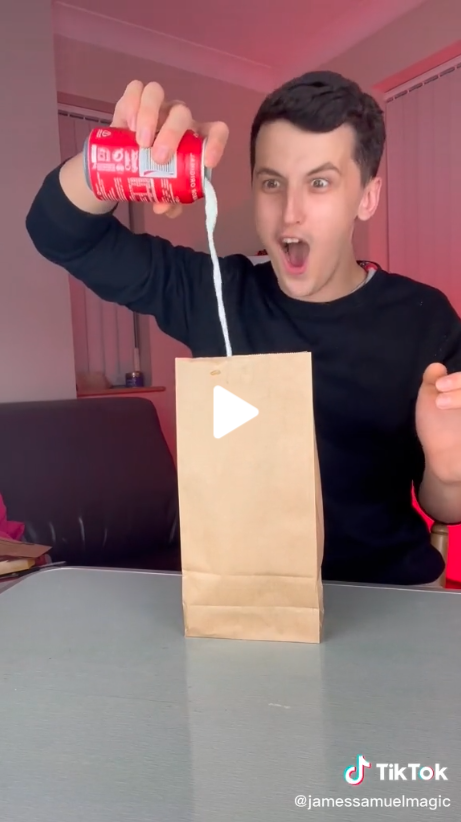TikTok magician James Samuel is awestruck as he pours milk out a can of coke into a brown paper bag