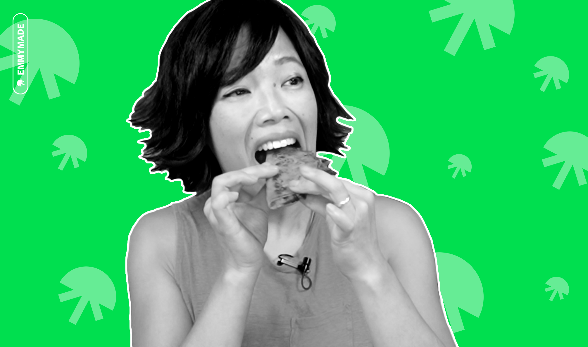 Creator Emmymade taking a bite out of food in black and white on a green background with jellyfish icons.