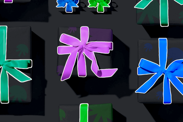 Black gift boxes with purple, blue and green bows