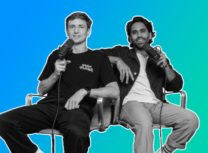 Creators Colin and Samir sitting down in black and white on a green and blue gradient background
