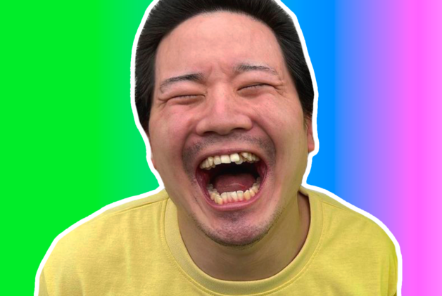 Japanese creator Junya smiling wide in a yellow t-shirt on a rainbow gradient background