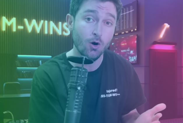 Creator Attorney Tom speaking into a microphone with a rainbow gradient overlay