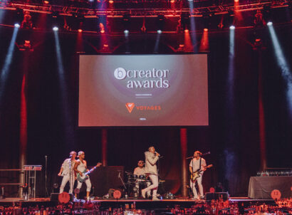 Fake Tan Band performing on stage in all white outfits at the bCreator Awards