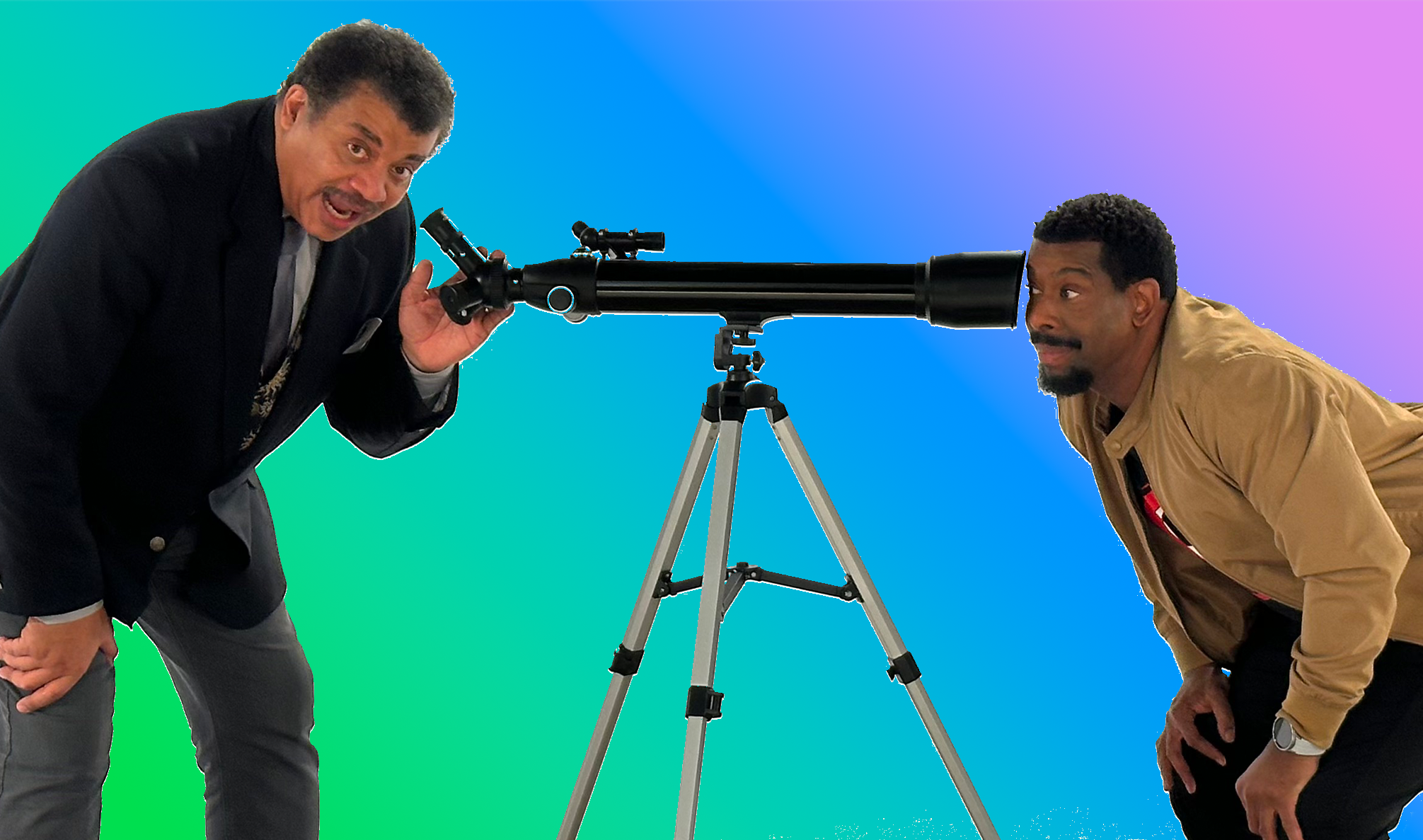 Neil deGrasse Tyson looks through a telescope as comedian Chuck Nice peers through the other side against a bright colorful background.